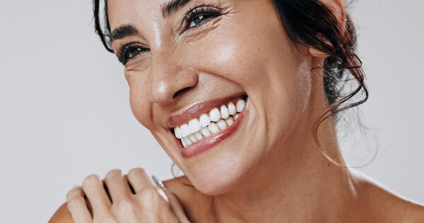 Smiling woman showing bright, healthy teeth