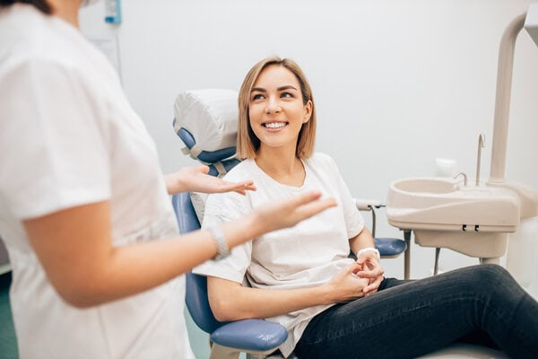 Patient smiling in the dental chair during a checkup