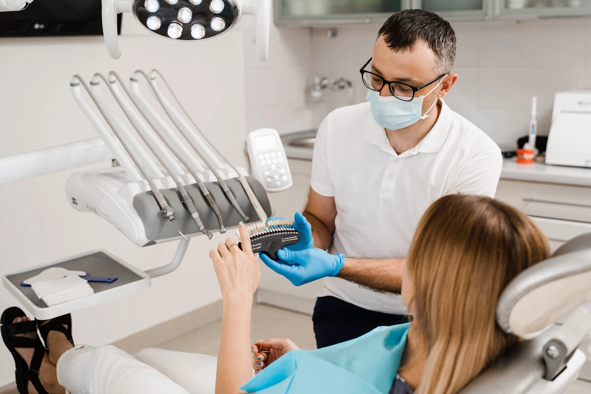 Dentist treating a patient with instruments laid out nearby
