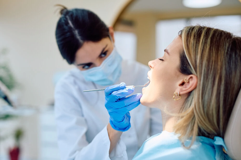 Dentist performing a routine dental checkup